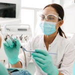 dentist performing procedure in their office