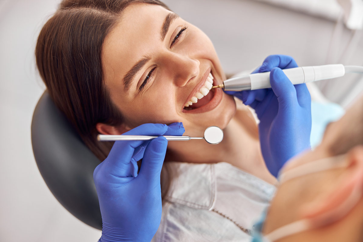 woman at dentist using tac 20 gel