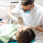 dentist using Topical 12.5 topical anesthetic for dental procedure